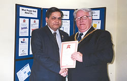 Dr.B.K.Sharma, founder of these charities receiving honour of the year award at the hands of Mayor of Walsall