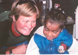 Child with HIV and our volunteer