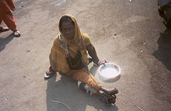 Street woman beggar with severe disability