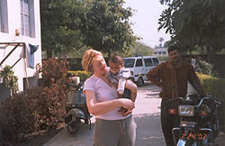 Volunteer and charity trustee Lynda McShane with a child at Gwalior hospital operated for cleft lip and palate.